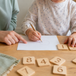 Parent using a kindergarten readiness checklist with a child at home`