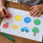 Kindergarten child coloring everyday objects with red, yellow, blue, green, and black crayons